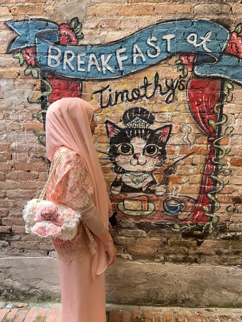 Farah with their BooBoo Plush bag